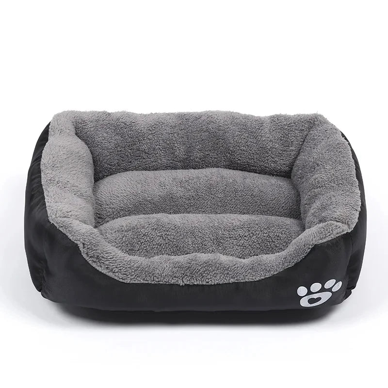 Plush rectangular dog bed with soft gray fleece lining and black exterior with paw print